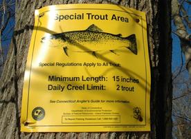 The regulation sign for fly fishing for sea run trout on the Saugatuck River in Westport Connecticut